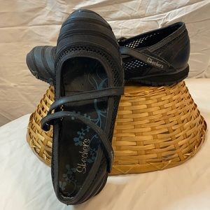 Skechers black slip on shoes with strap